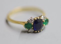 A 1970's 18ct gold, sapphire, emerald and diamond cluster ring, size P/Q, gross 3.2 grams.CONDITION: