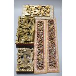 Five Chinese lacquer carved panels, longest 42cm