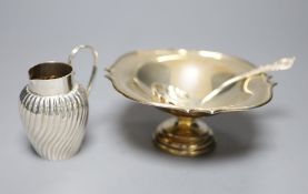 A silver shaped square small pedestal bowl, a silver spiral-fluted cream jug and a silver sifter