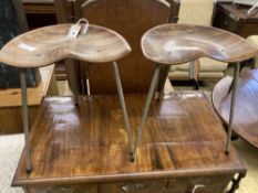 A pair of Arne Jacobsen-style saddle seat stools, width 39cm, depth 25cm, height 48cm