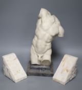A resin bust of a classical torso on stand and a pair of alabaster bookends