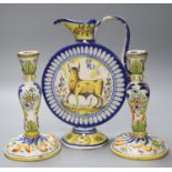 An Italian maiolica flask, height 30cm, and a pair of French faience candlesticks