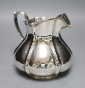 An Italian 800 standard white metal jug, of lobed bellied form, approx 21oz
