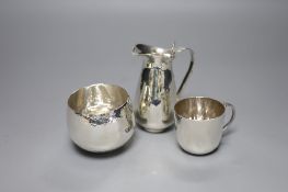 Four items of modern silver by Pruden and Smith, comprising a planished jug with angel handle, a