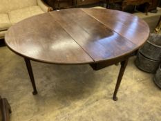 A George III oak drop leaf dining table, width 122cm, depth 178cm extended, height 73cm