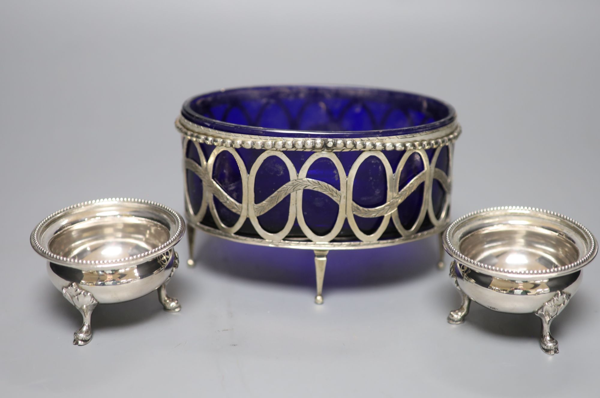 An 18th/19th century Continental white metal beaded openwork oval table salt cellar with blue