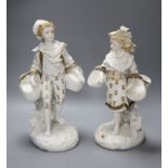 A pair of 19th century bisque gilt painted and decorated figures of a peasant boy and girl
