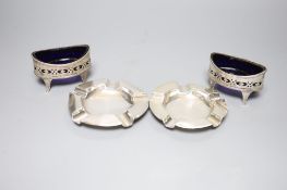 A pair of Victorian pierced silver navette shaped salts, London, 1896 and two later silver