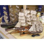 Three model ships: The Cutty Sark, The USS Constitution and Fragata, together with a carved wood