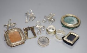 A set of four silver wire 'initial' napkin rings, two other silver napkin rings (one Asprey) and