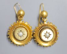 A pair of Victorian yellow metal and split pearl set target earrings, 20mm, gross 9 grams.CONDITION: