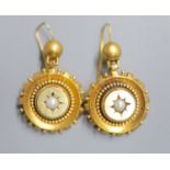 A pair of Victorian yellow metal and split pearl set target earrings, 20mm, gross 9 grams.CONDITION: