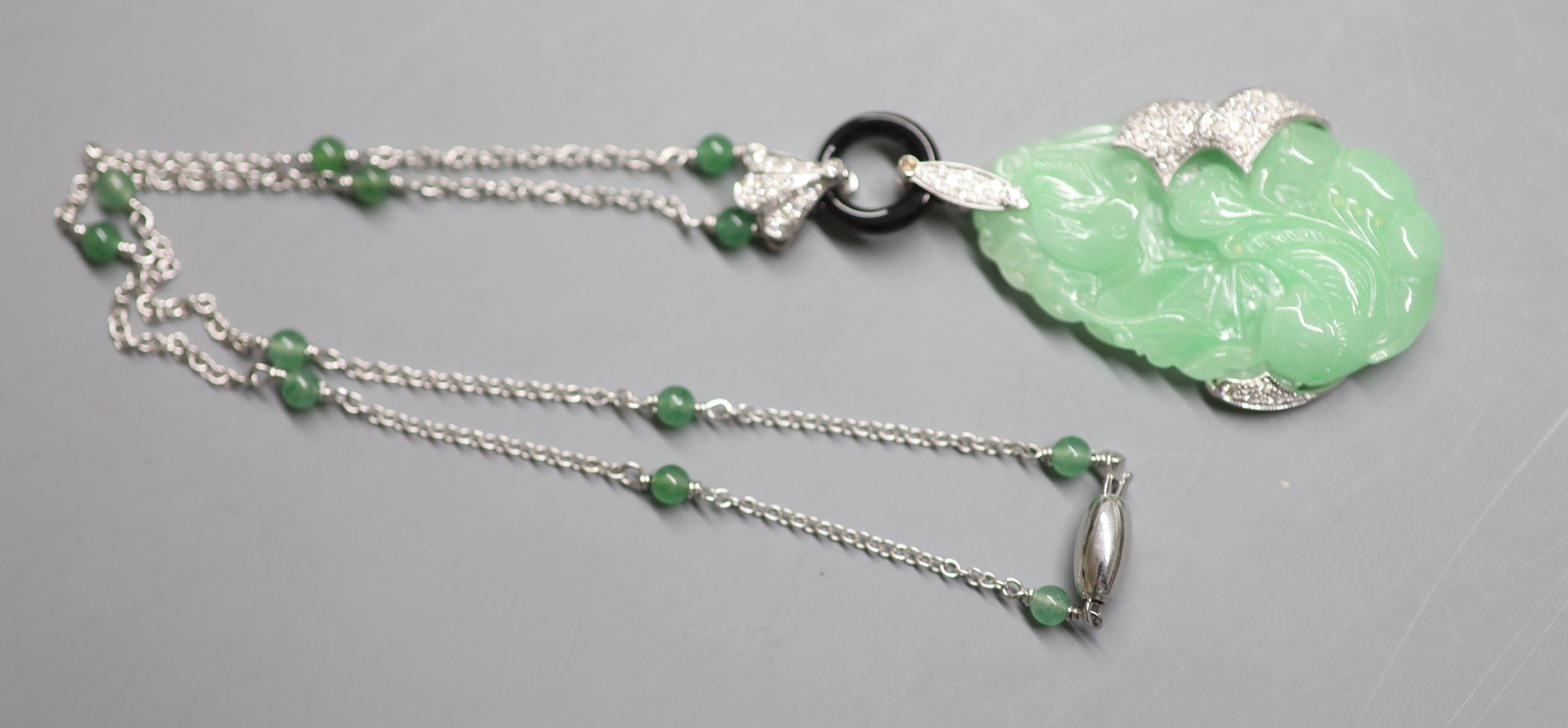 A modern Italian 750 white metal, carved jadeite, black onyx and diamond set pendant necklace, - Image 2 of 3