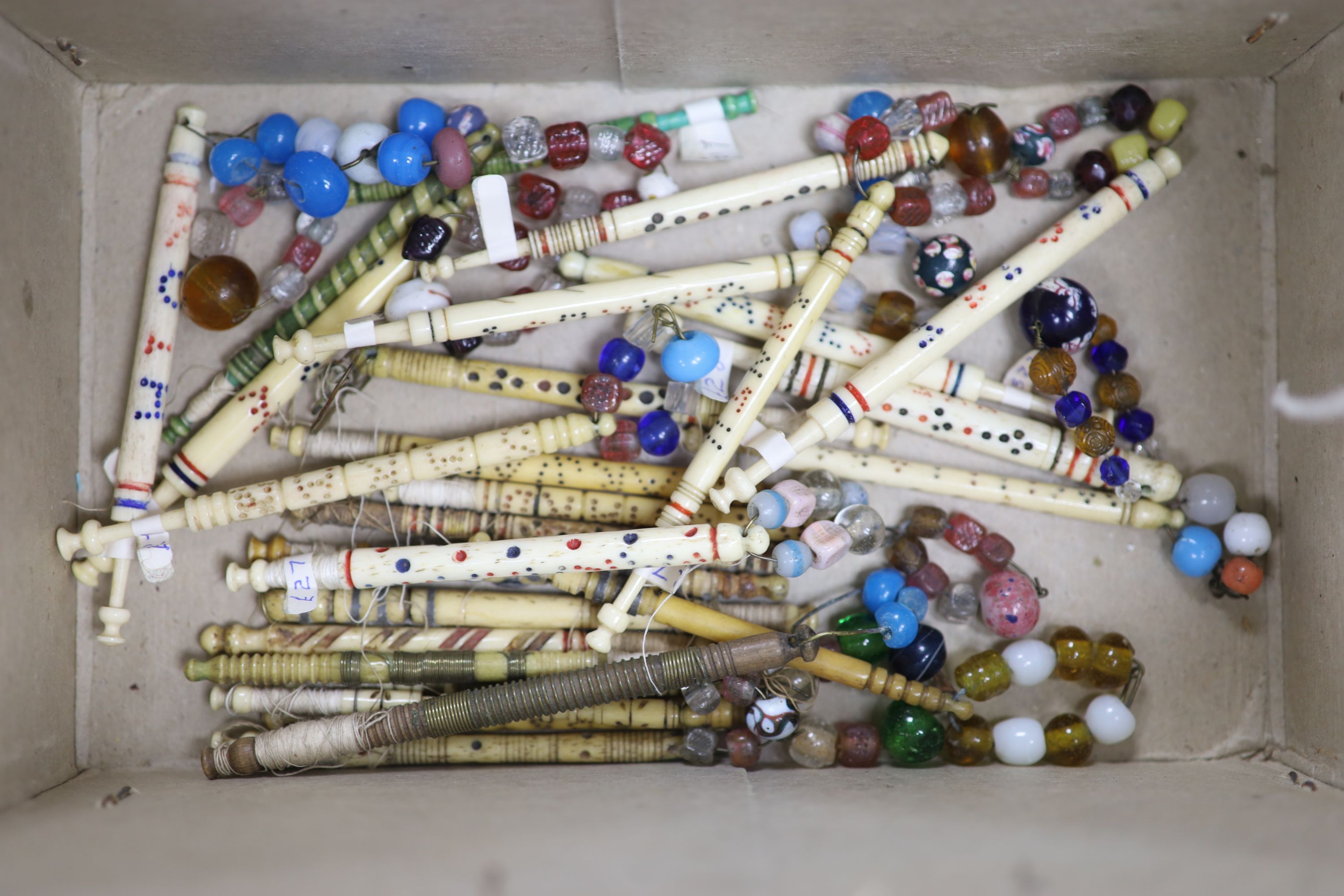 A small collection of Victorian lace-maker's bone bobbins, some named