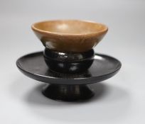 A Chinese Tenmoku tea bowl, diameter 9.5cm, and a lacquer stand