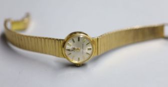 A lady's 9ct gold Eterna-Matic manual wind wrist watch, on a 9ct gold bracelet, overall 16cm,