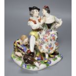 A Meissen porcelain group, The Indiscreet Harlequin, 19th century, height 16cm (a.f.)