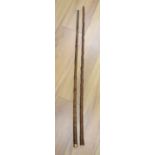 A yellow metal mounted bamboo cane and a gilt metal mounted cane