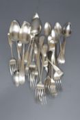 A set of eight George III Irish bright cut engraved Celtic tip spoons and three table spoons, Jon