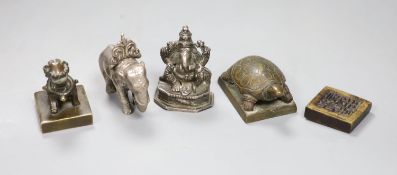 A group of Chinese bronze seals and a white metal elephant