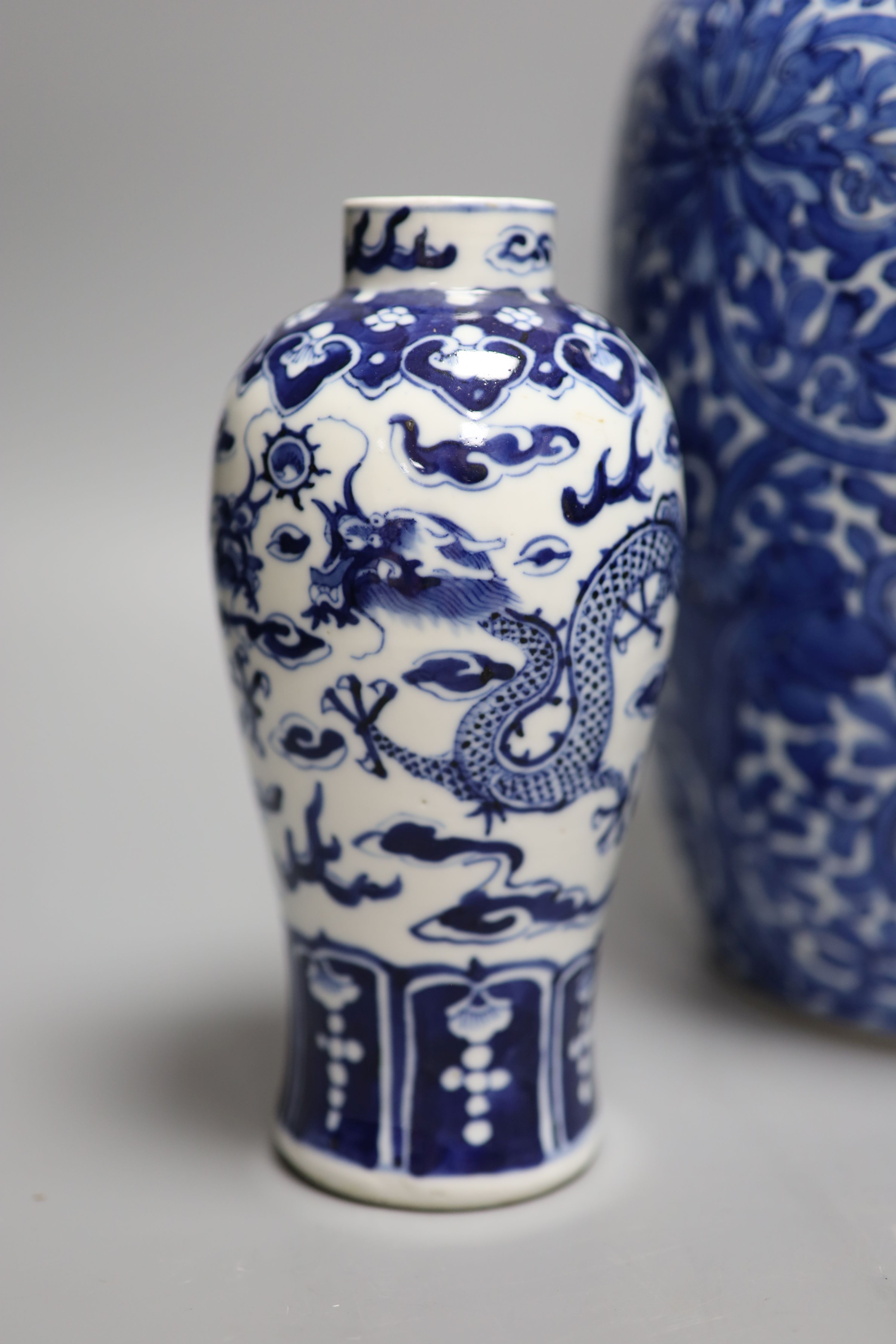 A Chinese blue and white 'lotus' jar and cover, early 20th century, a similar 'dragon' vase and a - Image 2 of 8