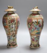 A pair of 19th century Chinese famille rose vases and associated covers, height excl. cover 28cm (