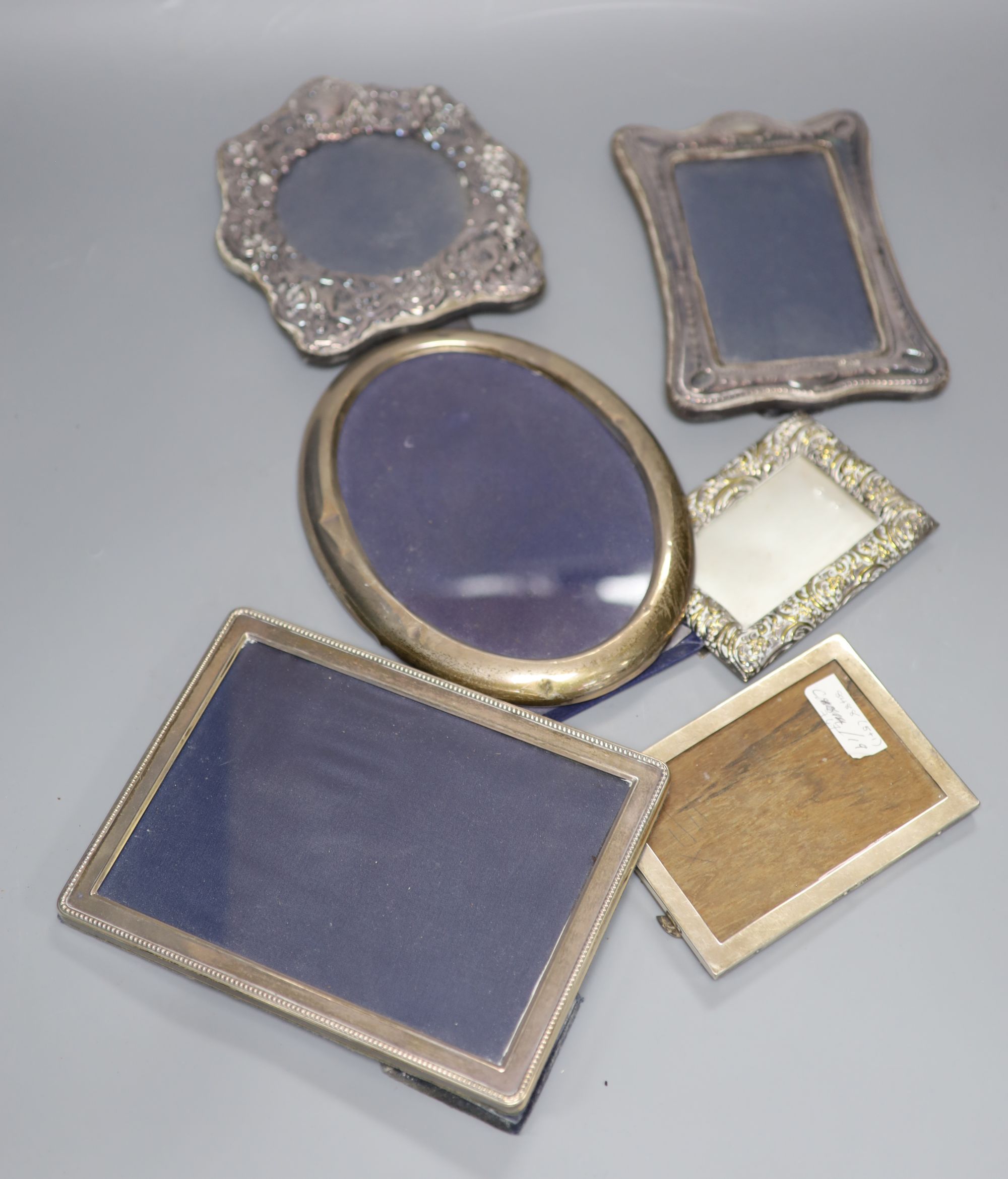 Four assorted silver mounted photograph frames, largest 21cm, one other white metal frame and a