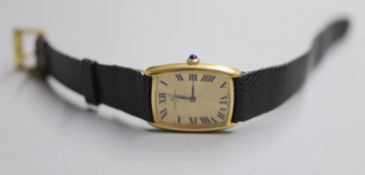 A gentleman's stylish 18k Baume & Mercier manual wind dress wrist watch, on associated leather