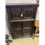 A 17th century style oak cupboard, width 100cm depth 42cm height 140cm