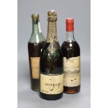 A 1915 bottle of Heidsieck, a bottle of Barsac and a K.P. Charente brandy by Peters Hall & Co,