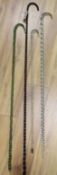 A 19th century Nailsea glass walking stick and three others (4)