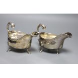 A pair of George III silver sauceboats, London, 1764?, marks rubbed, length 16.5cm, 15.5oz.