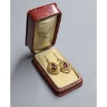 A pair of Victorian yellow metal and garnet set oval drop earrings, 18mm, gross 4 grams.CONDITION: A