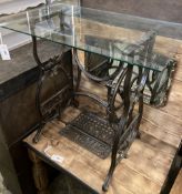 A Victorian Newhome cast iron treadle sewing machine base now as a glass top occasional table, width