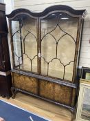 A Queen Anne revival burr walnut glazed china display cabinet, combined cupboard, length 136cm,