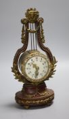 An early 20th century French lyre shaped mantel timepiece, with enamelled dial, height 26.5cm