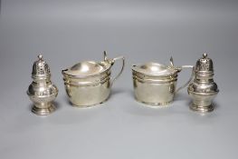 A pair of Victorian silver mustards, London, 1892/4 and a pair of Victorian silver pepperettes,