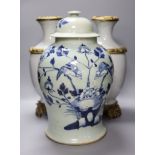 A pair of Chinese crackleglaze vases and a blue and white vase and cover, height 43cm
