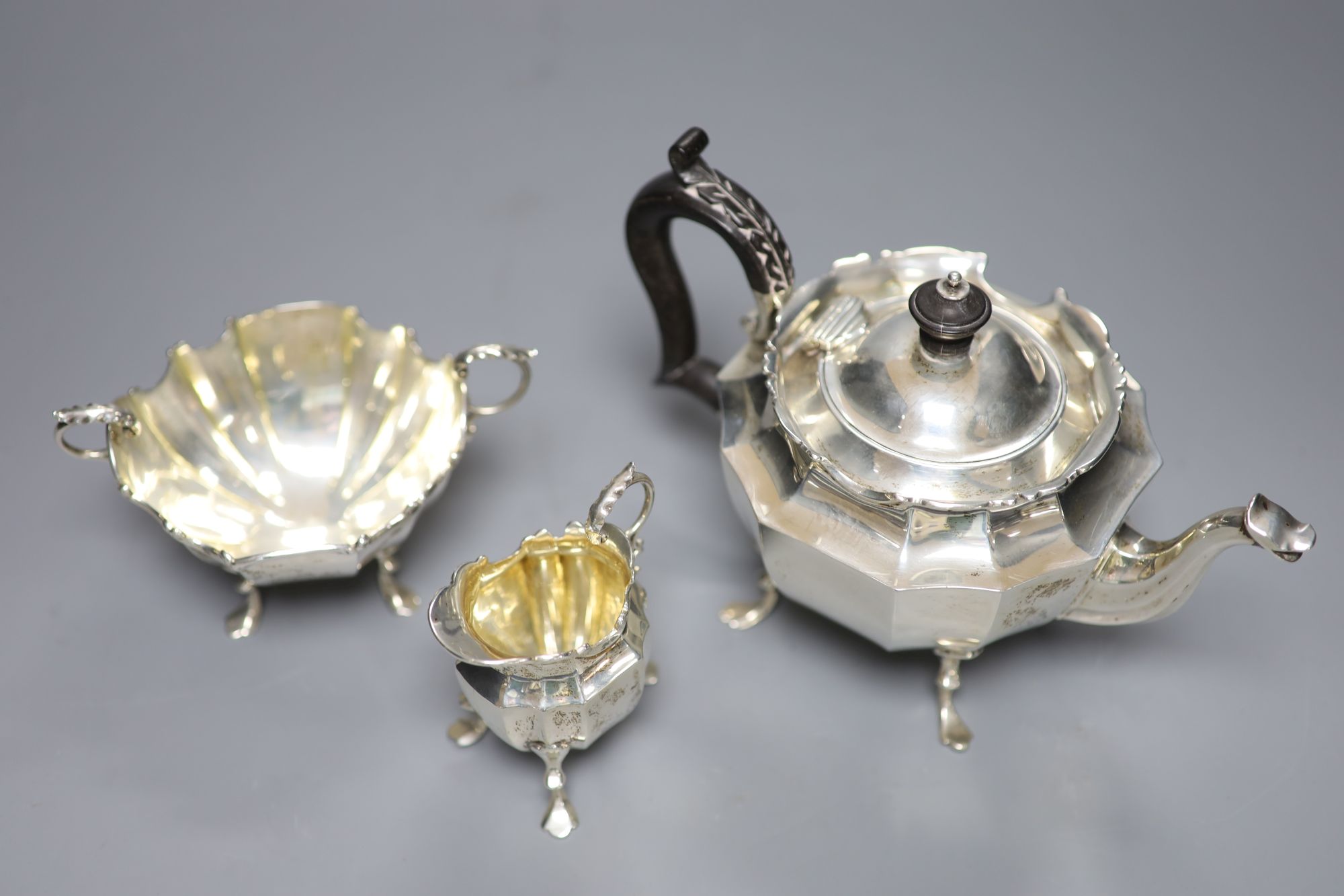 A late Victorian three-piece silver tea service of shaped stylised outline, J. R. Ltd, Birmingham - Image 2 of 2