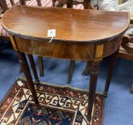 A late George III satinwood banded mahogany 'D' shaped side table, fitted frieze drawer, width 71cm,