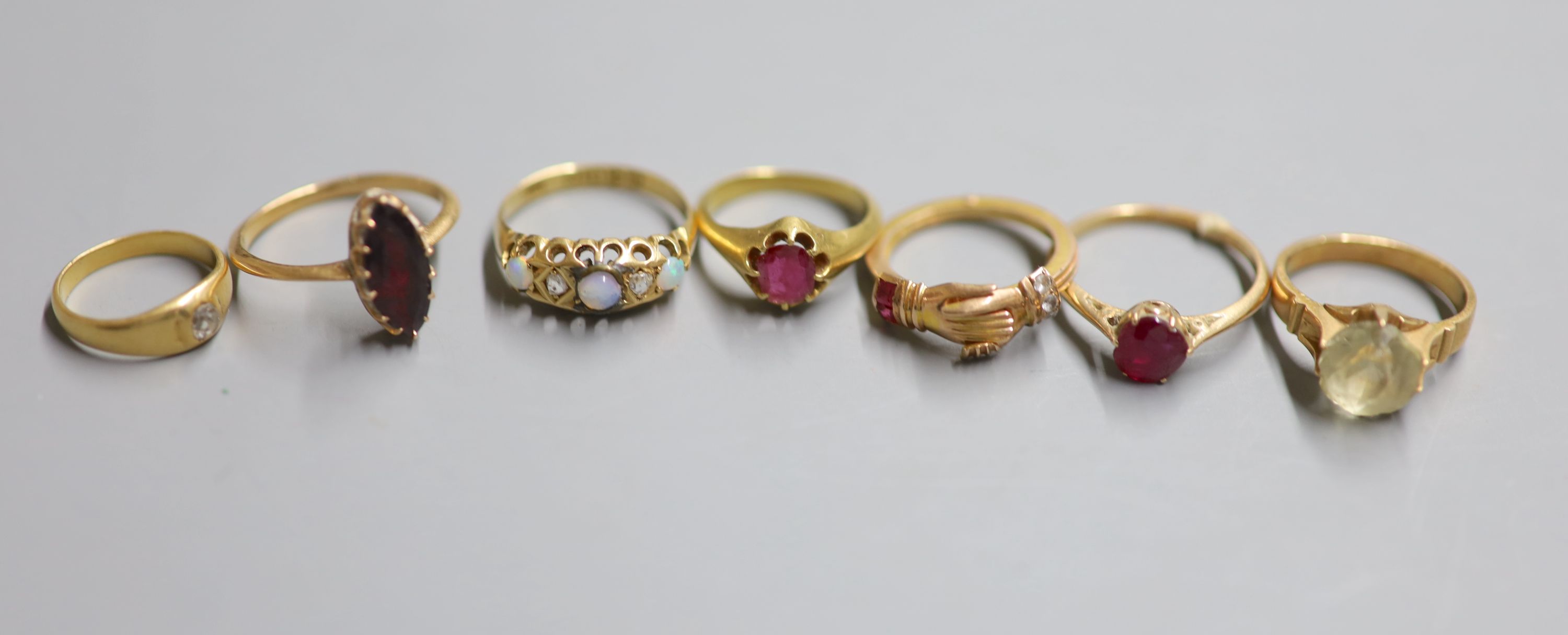 Seven assorted rings, including George V 18ct gold, opal and diamond five stone ring, size L,