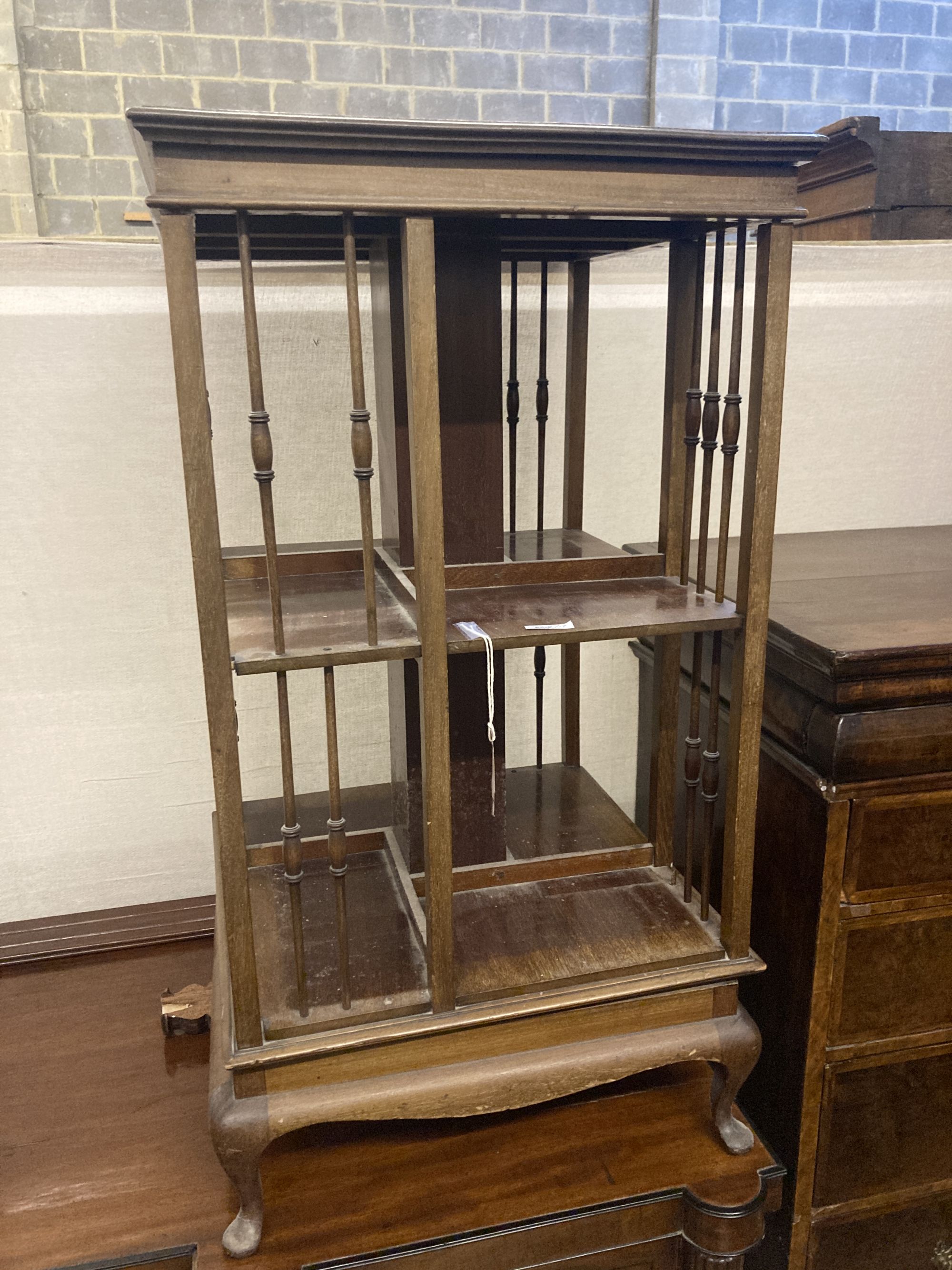 An Edwardian satinwood banded mahogany revolving bookcase, width 48cm height 89cm