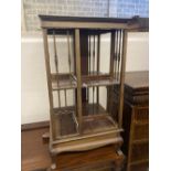 An Edwardian satinwood banded mahogany revolving bookcase, width 48cm height 89cm