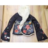 A Chinese black silk polychrome embroidered child's / ladies jacket, embroidered in Chinese knot and