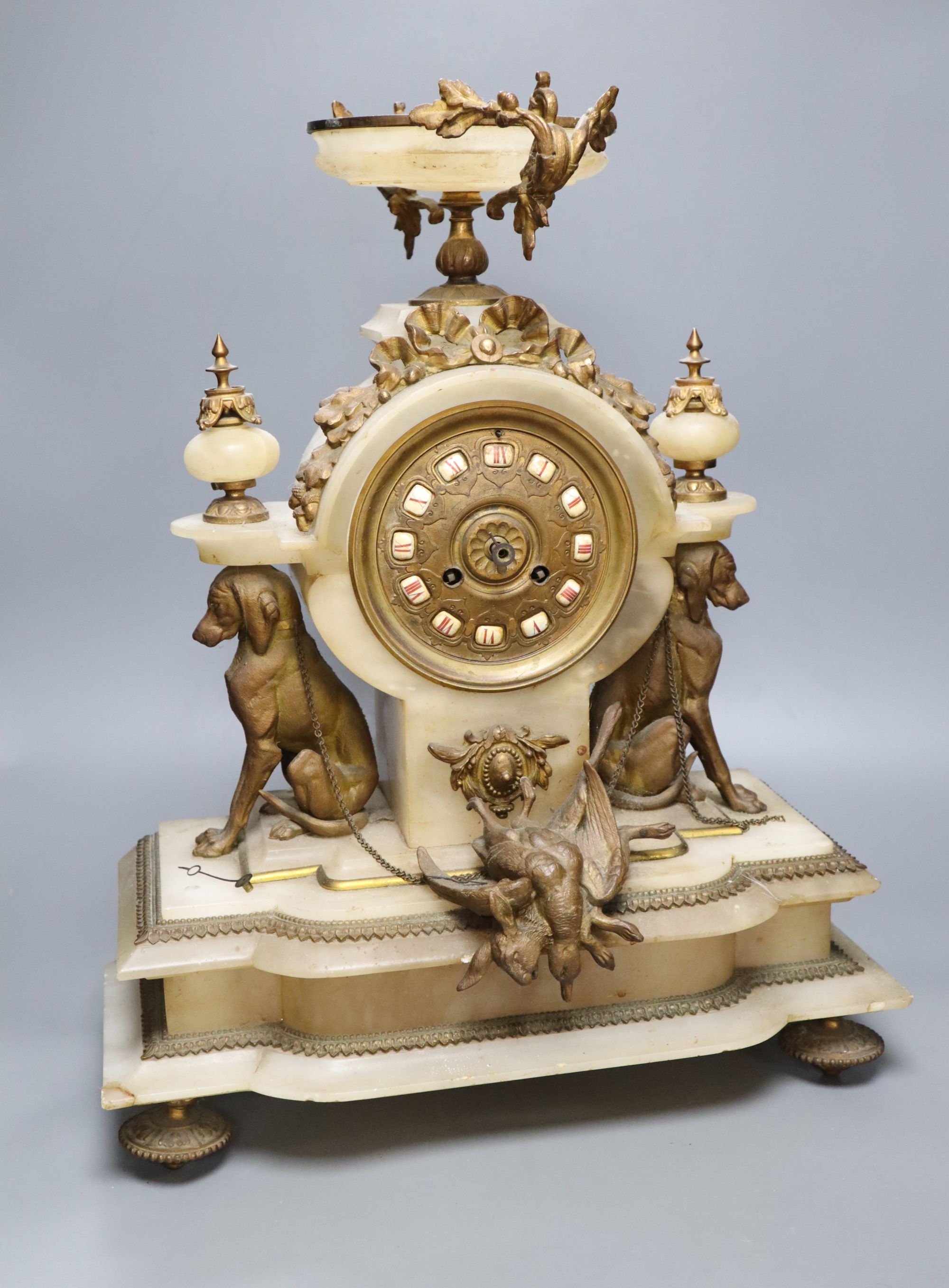 A French gilt metal and alabaster mantel clock, height 49cm