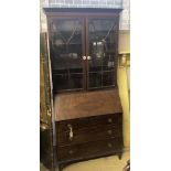 A 1920's mahogany bureau bookcase, width 92cm depth 44cm height 209cm