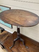 A 19th century mahogany oval tripod wine table, width 54cm, depth 40cm, height 70cm