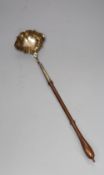 A George II silver toddy ladle, with turned wooden handle, John Pollock, London, 1742, 37.8cm, gross