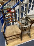 A rush seated beech elbow chair, a vintage five tread step ladder, a similar pine step stool and two