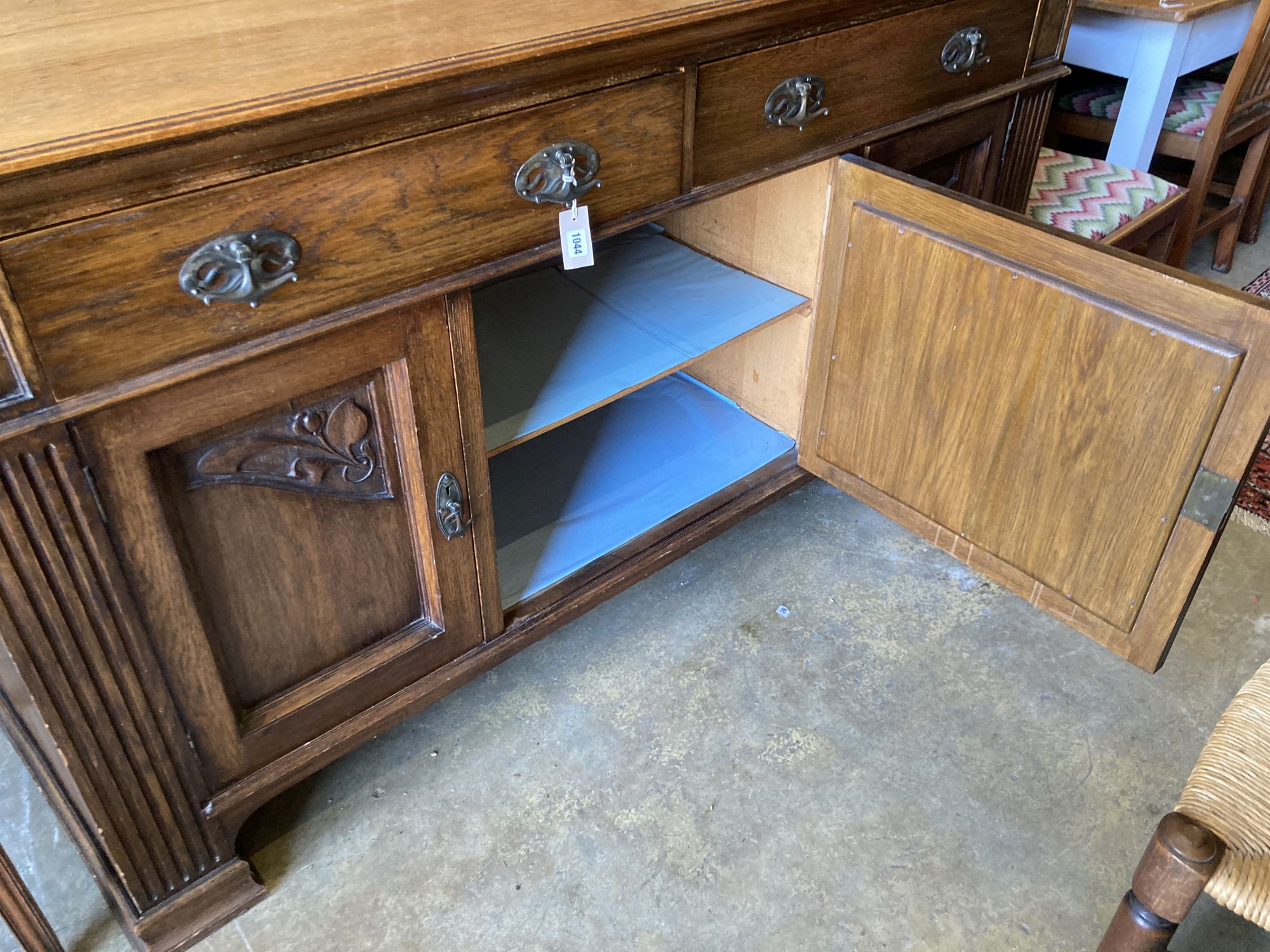 A late Victorian Art Nouveau carved oak sideboard, length 186cm, depth 62cm, height 102cm - Image 3 of 5